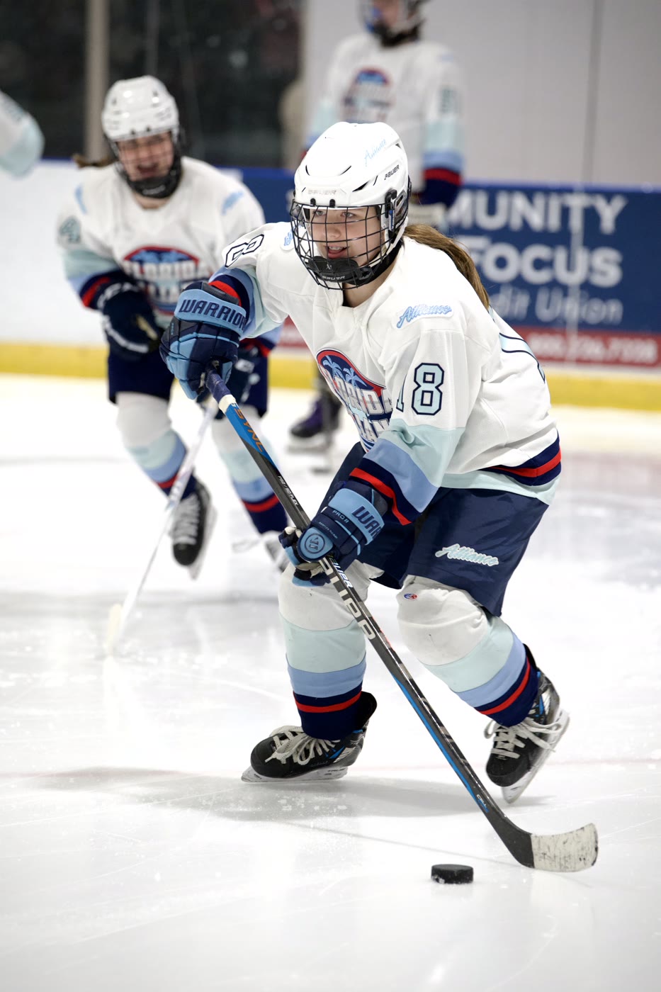 Head up and eyes up ice, puck on her stick and nobody in her field of view